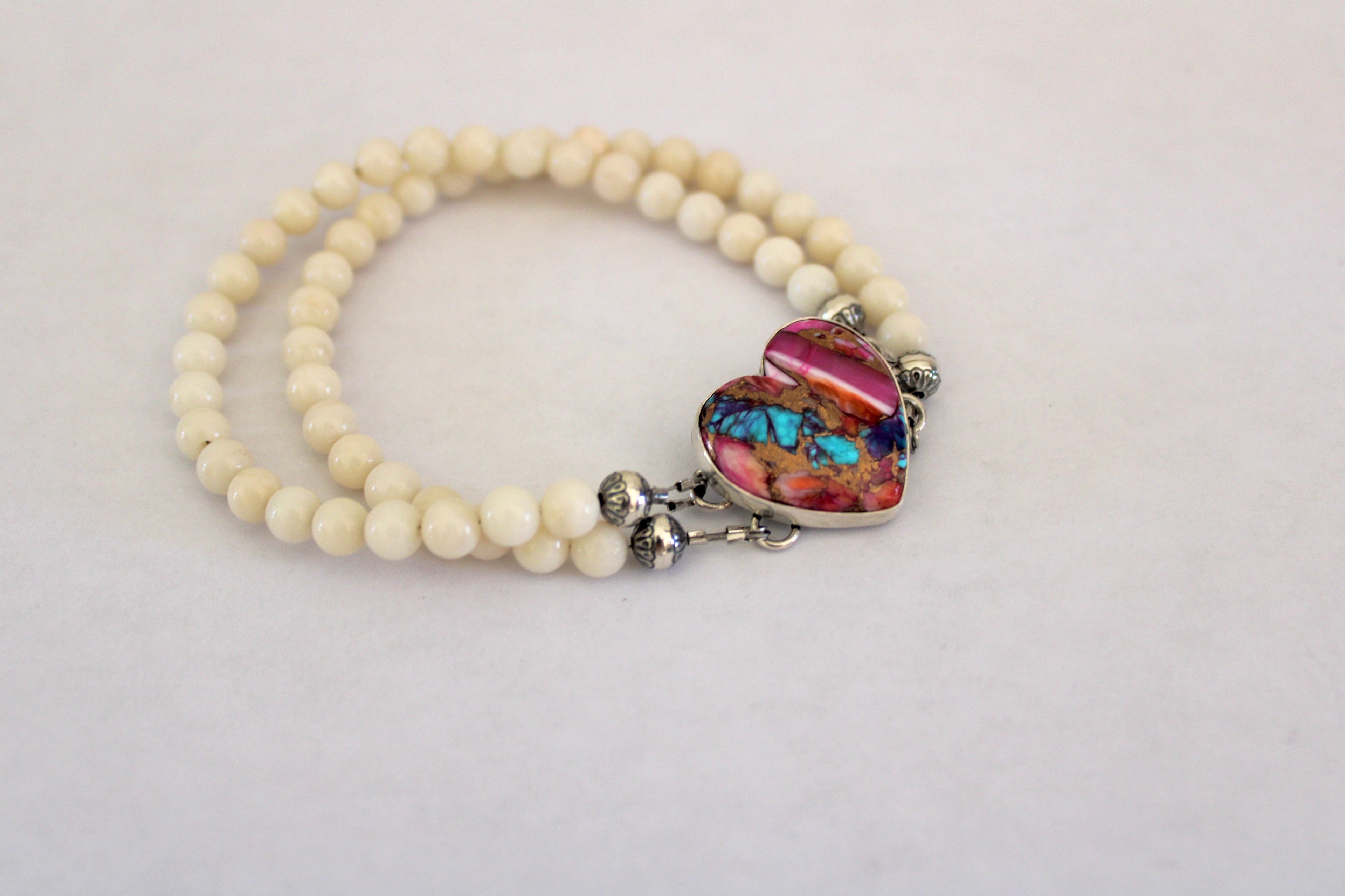 Pink Dahlia Turquoise Heart on a white coral beaded bracelet