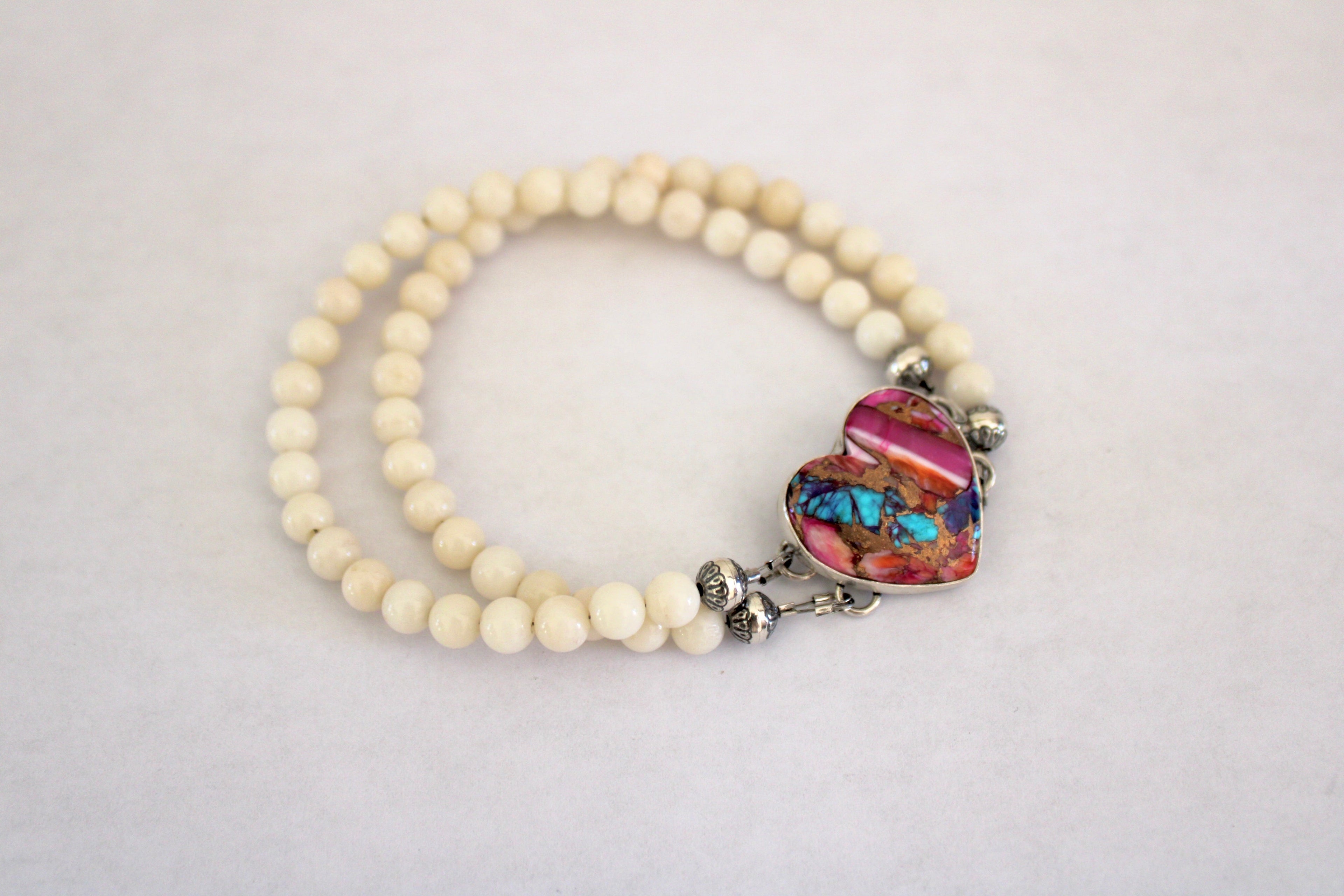 Pink Dahlia Turquoise Heart on a white coral beaded bracelet