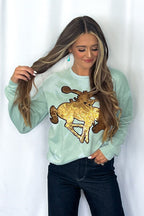 Crazy Consuela "Gold Sequin Horse" Bleached Western Sweatshirt — Bella + Canvas Aqua Sky Background with Cowboy Patch