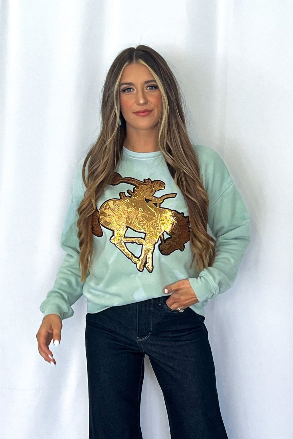 Crazy Consuela "Gold Sequin Horse" Bleached Western Sweatshirt — Bella + Canvas Aqua Sky Background with Cowboy Patch