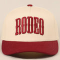 "RODEO" Two-Tone Embroidered Trucker Hat — Wine Red Cotton Canvas with Raised Lettering & 5-Panel Structure