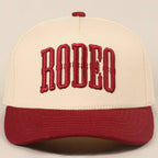 "RODEO" Two-Tone Embroidered Trucker Hat — Wine Red Cotton Canvas with Raised Lettering & 5-Panel Structure